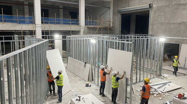 Calcium silicate boards installed in fire-rated partition wall system